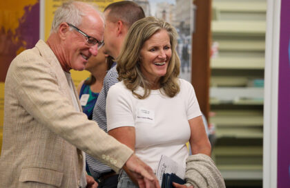 two attendees enjoy the exhibit and learn things about migration that will last a lifetime